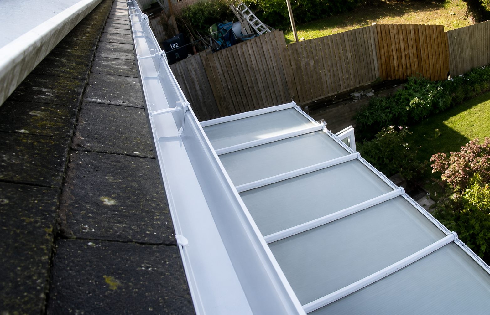 Birmingham gutter after professional cleaning showing clear channels and proper water flow